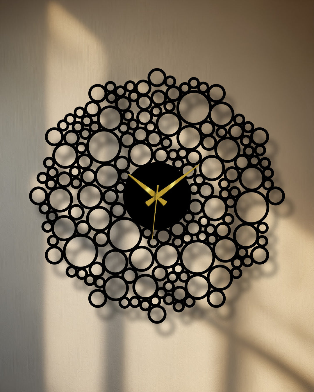 The black metal decorative metal art forms striking shapes in this modern geometric bubble clock due to the contrasting spaces in its mesh design.