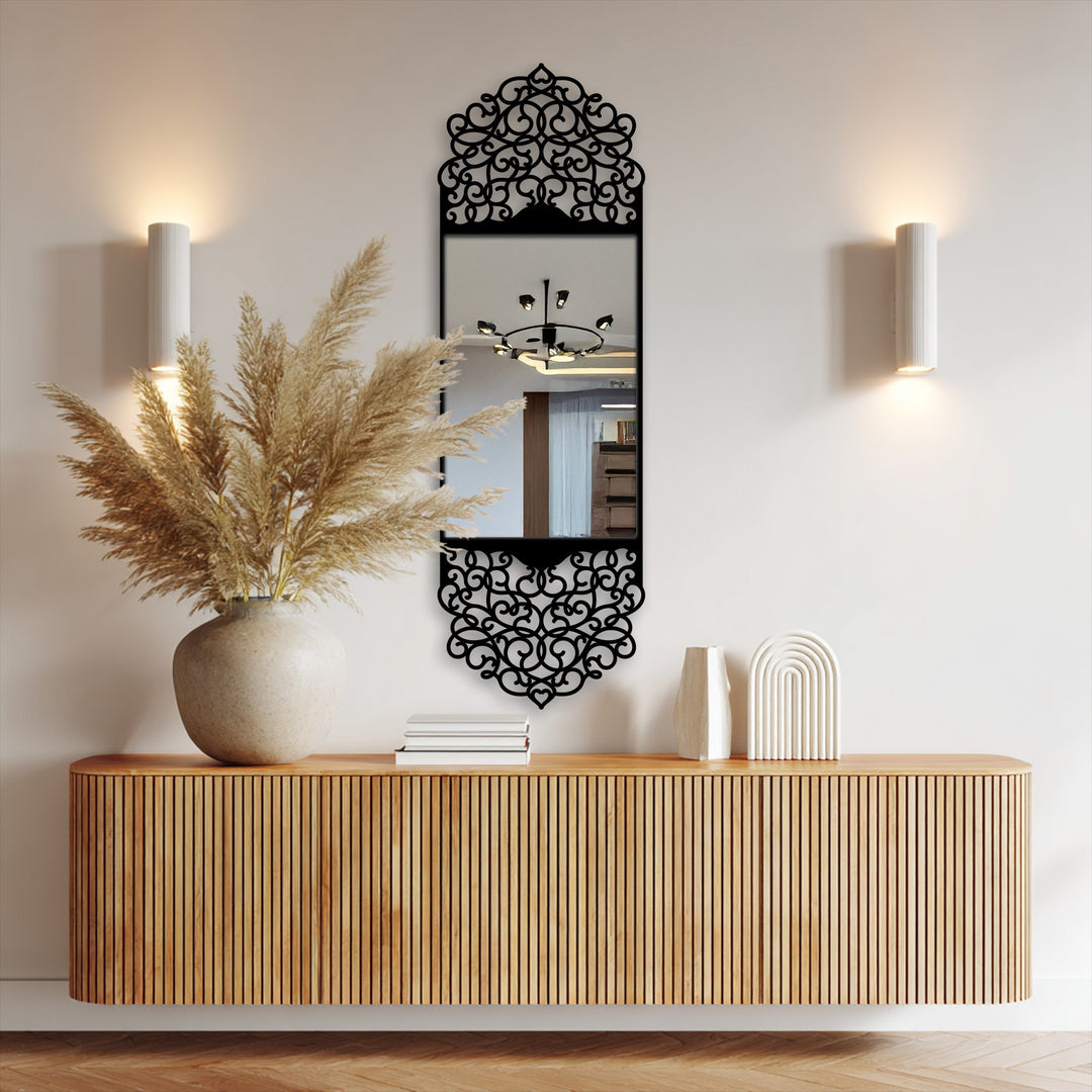 Reduced color saturation highlights the black metal arabesque arch frame of this decorative mirror, adding a muted, elegant touch.