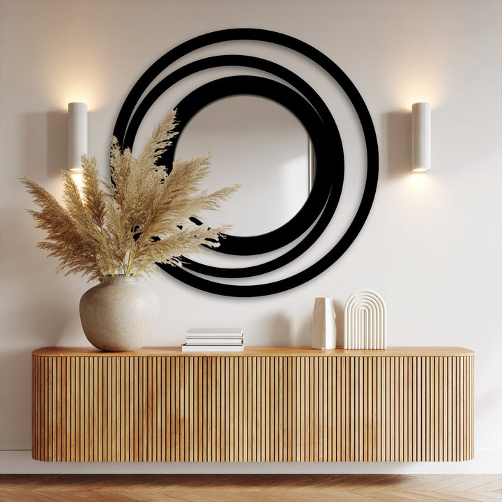 Horizontally oriented round Orbit Ring floor mirror features a striking concentric circle design, offering a unique touch to your wall decor mirror for wall decor.
