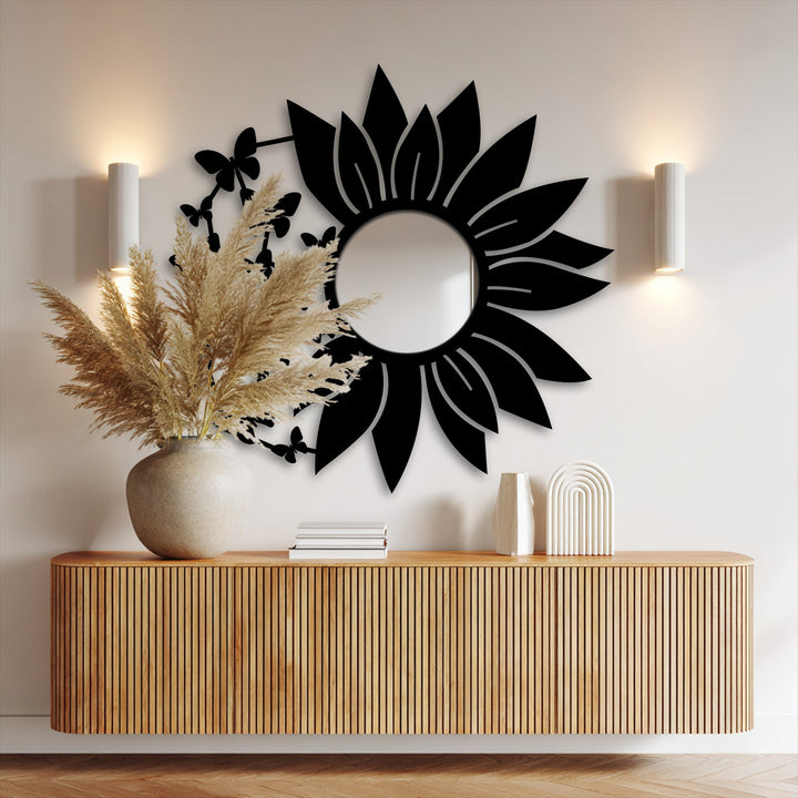 Illuminating the elegant butterfly bloom mirror for wall decor, light and shadow create depth within its floral silhouette and intricate metal artwork.