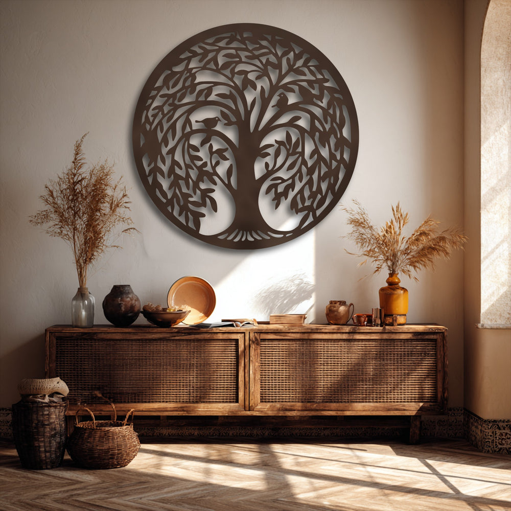 Golden sunlight illuminates a round Tree of Life metal artwork, creating striking shadow patterns across the wall and floor.