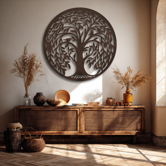 Golden sunlight illuminates a round Tree of Life metal artwork, creating striking shadow patterns across the wall and floor.
