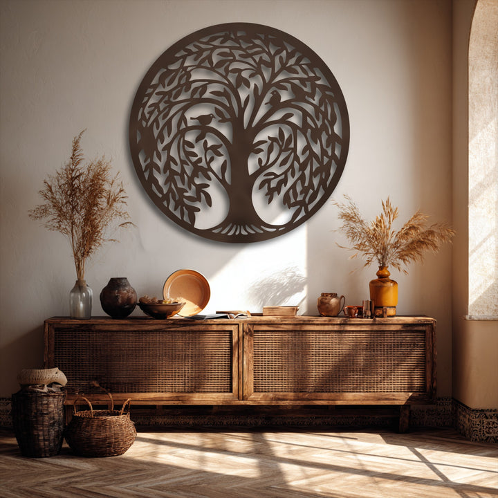 Golden sunlight illuminates a round Tree of Life metal artwork, creating striking shadow patterns across the wall and floor.