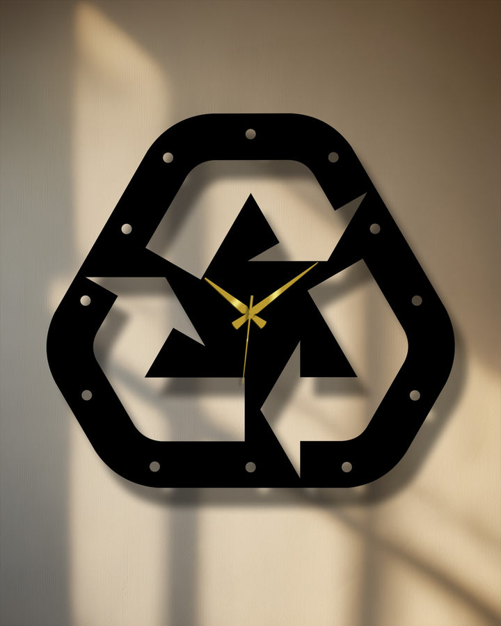 Visual rhythm is created in this recycle symbol metal artwork clock by the repeating triangular shapes and circular accents within its eco-modern design.