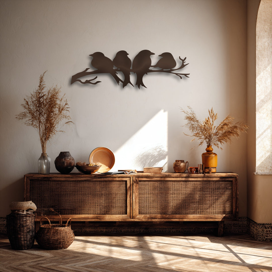 The prominent dark silhouette of four birds on a branch metal artwork captivates as the room's central focal point.