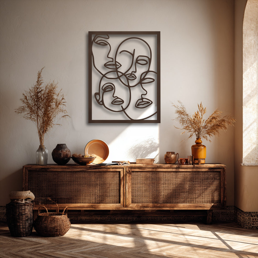 The realistic detail of the abstract faces line art metal wall decor creates captivating shadows on the textured wall.