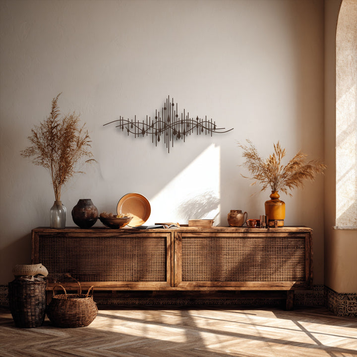 The crisp, dark edges of the abstract soundwave metal art for wall feature undulating lines and vertical bars.