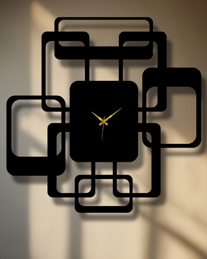 Sunlit tan wall provides a textured backdrop for this modern metal wall clock with its interlocking squares, highlighting the contrast in this geometric metal artwork.