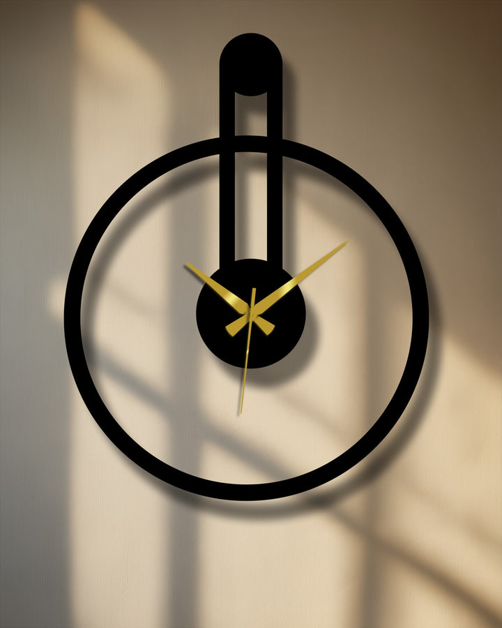 Featuring the focal point, this minimalist round metal wall clock, with its modern vertical accent, offers a stylish addition to your metal wall decor.