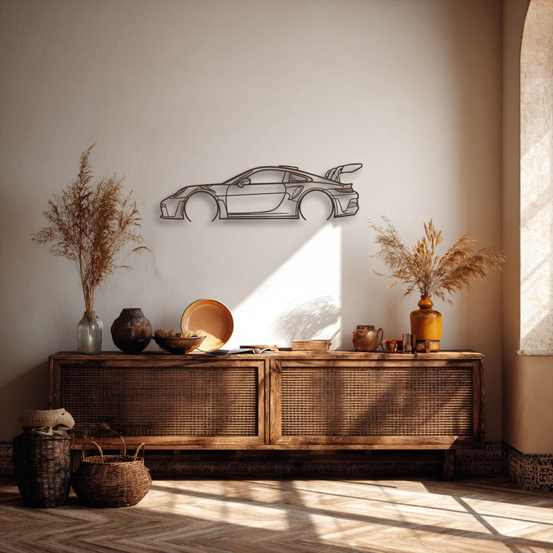 Organic curves highlight the design of the unique metal wall art, a sport car outline, complemented by the round vases and dried botanicals on the wooden console.