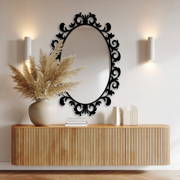 Surface texture of the imperial scroll leaf oval mirror for wall decor shows an ornate, smooth black frame surrounding a reflective glass surface.
