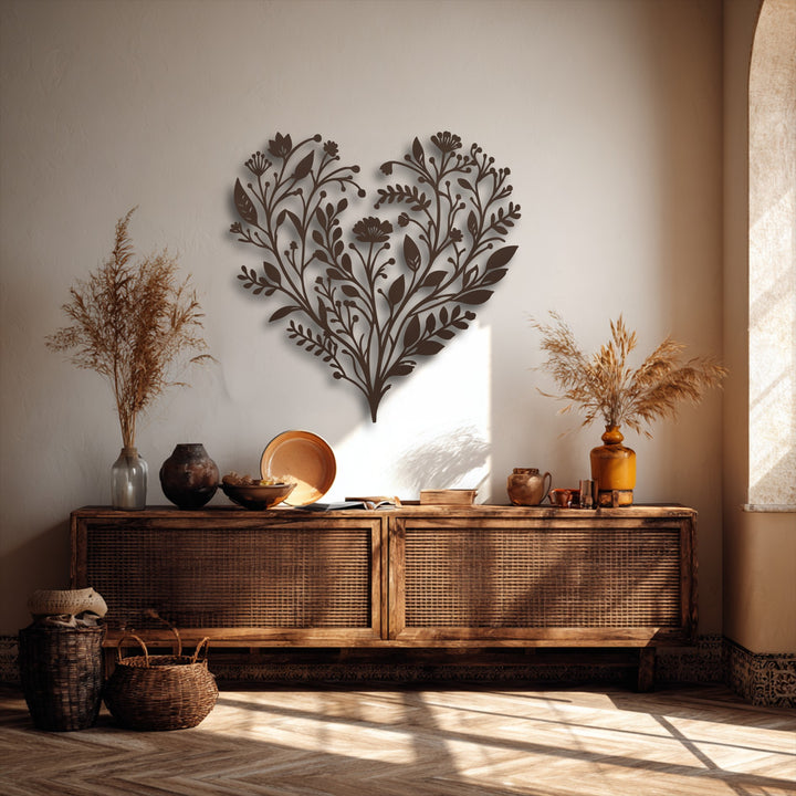Dramatic light and shadow highlight the elegant botanical heart decoration wall art, casting intricate patterns on the subtly textured wall.