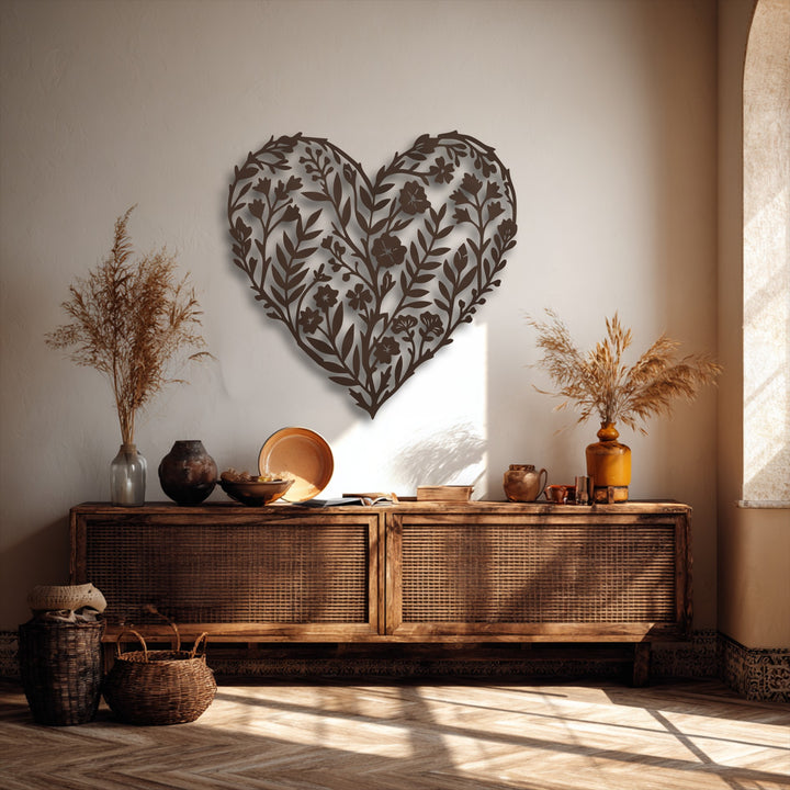 The sophisticated dark brown matte finish of this intricate botanical heart metal art for wall casts elegant shadows, emphasizing its design.