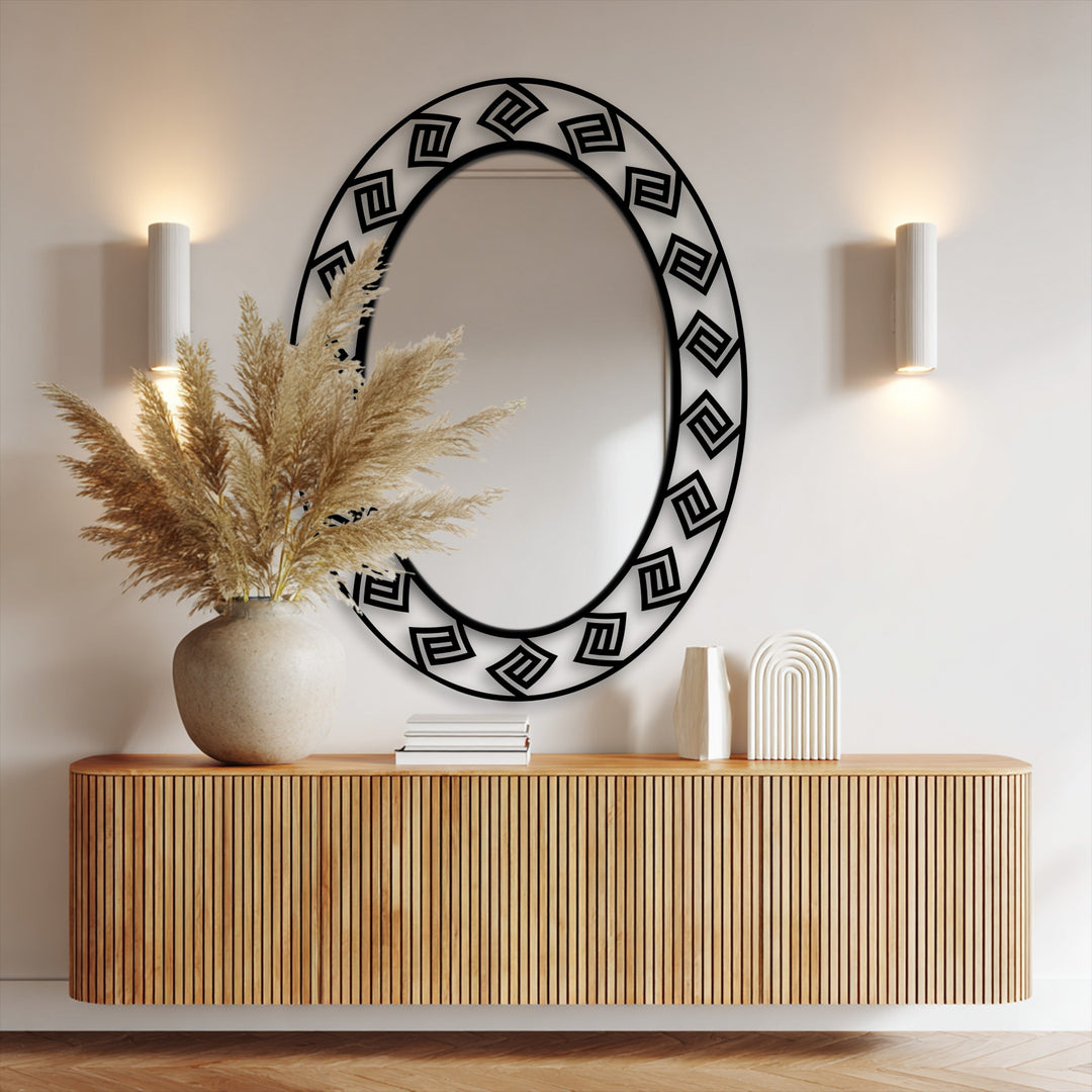 Detailed surface texture highlights the modern Greek key pattern oval floor decorative mirror, its black metal frame adding an artistic touch.