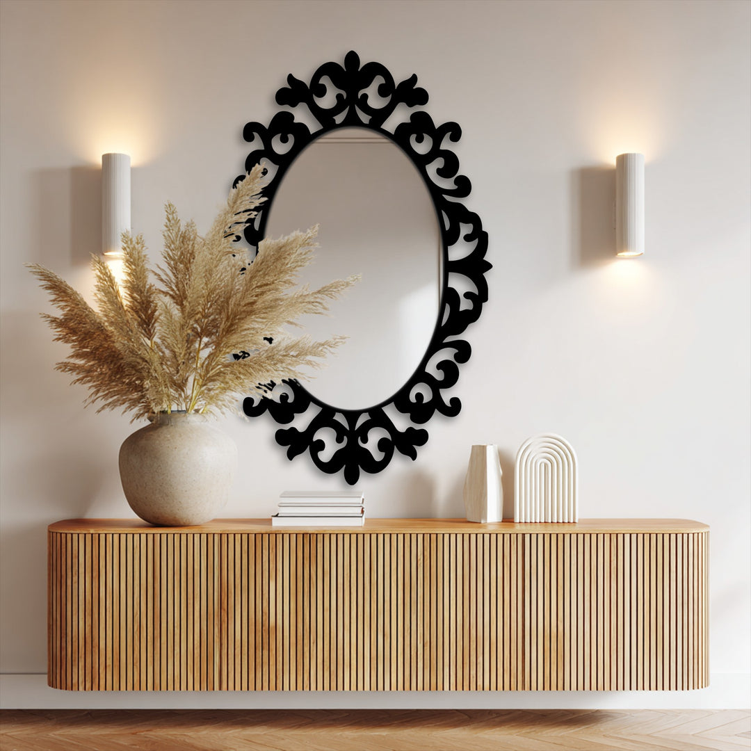 Framed wall mirror with a decorative baroque frame featuring organic floral motifs creates a balanced, naturally inspired aesthetic above the wooden console.