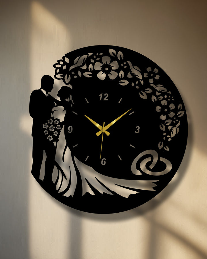 Muted color saturation highlights the sharp black and metallic silver of this romantic wedding silhouette metal wall clock, ideal decoration wall art.