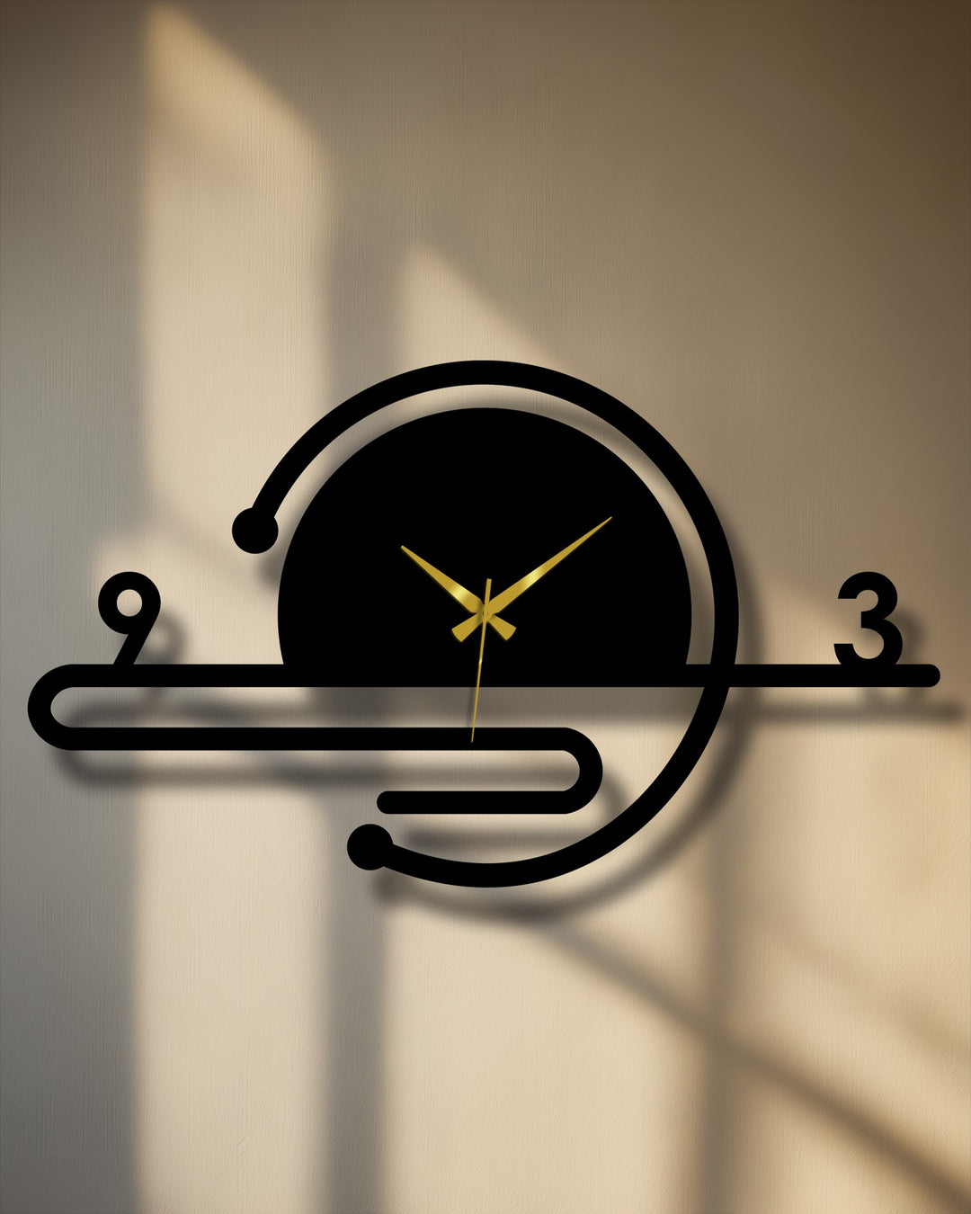 With its warm-toned lighting, the minimalist orbit line metal wall clock makes an inviting decorative wall art piece with geometric lines and gold hands.