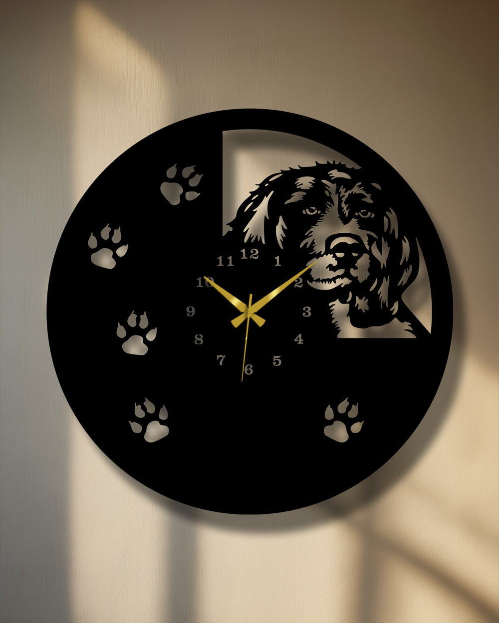 Softly illuminated paw prints and a gentle wall texture highlight this elegant dog silhouette metal artwork wall clock design.