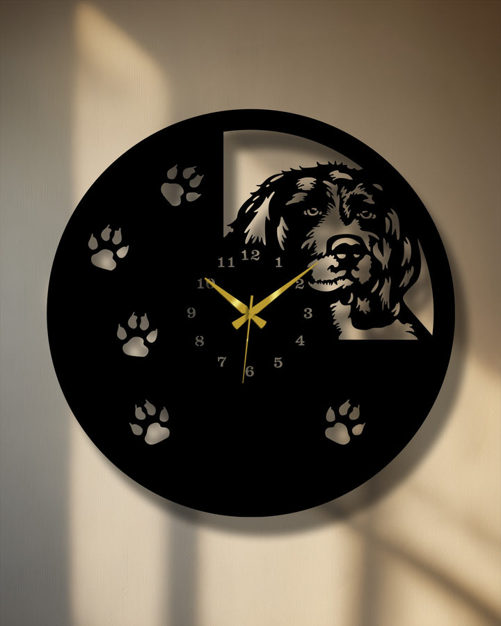 Softly illuminated paw prints and a gentle wall texture highlight this elegant dog silhouette metal artwork wall clock design.