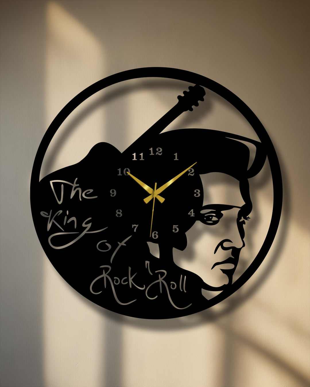 The darkest area reveals the bold black silhouette of Elvis Presley and a guitar, creating a unique rock music icon decorative metal art wall clock.