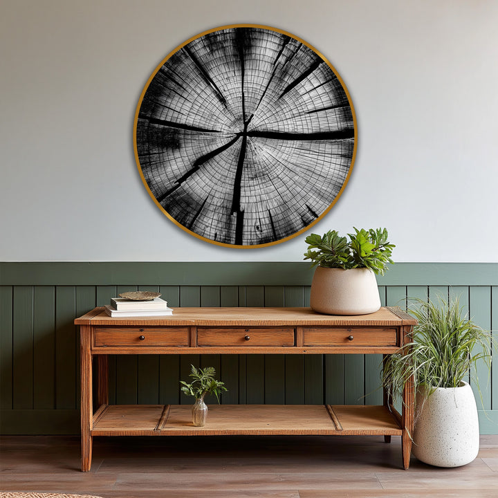 Highlighting the geometric elements, this minimalist round oil painting art piece presents concentric tree rings as a striking study in black and white on wood.