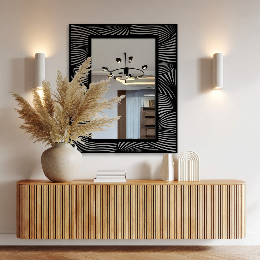 Reflecting the room's soft hues, the framed wall mirror features a sleek black abstract wave pattern that creates a visually appealing transition between light and shadow.