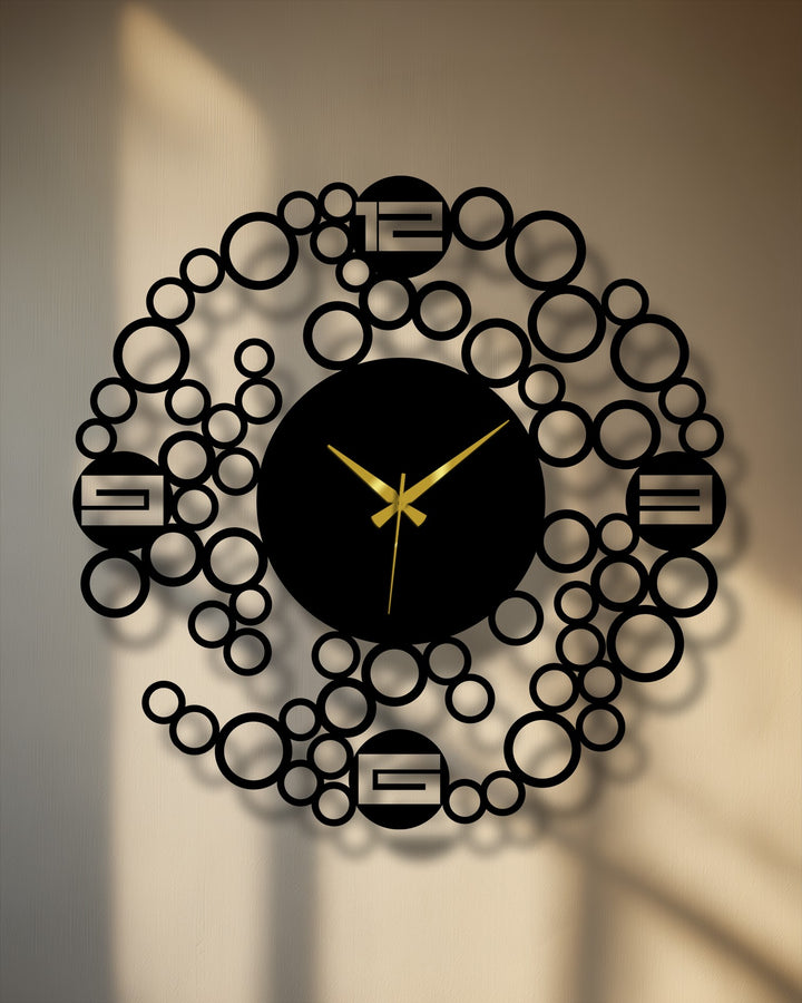 Warm sunlight casts a glow on this modern bubble ring metal wall clock, enhancing its decoration wall art appeal with minimalist geometric design.
