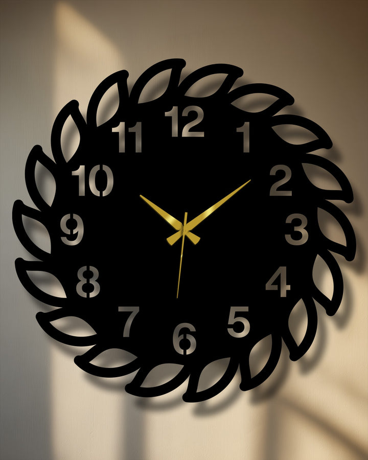 Dramatic golden clock hands emphasize the time on this decorative leaf frame metal wall clock, a unique metal wall art piece for stylish timekeeping.