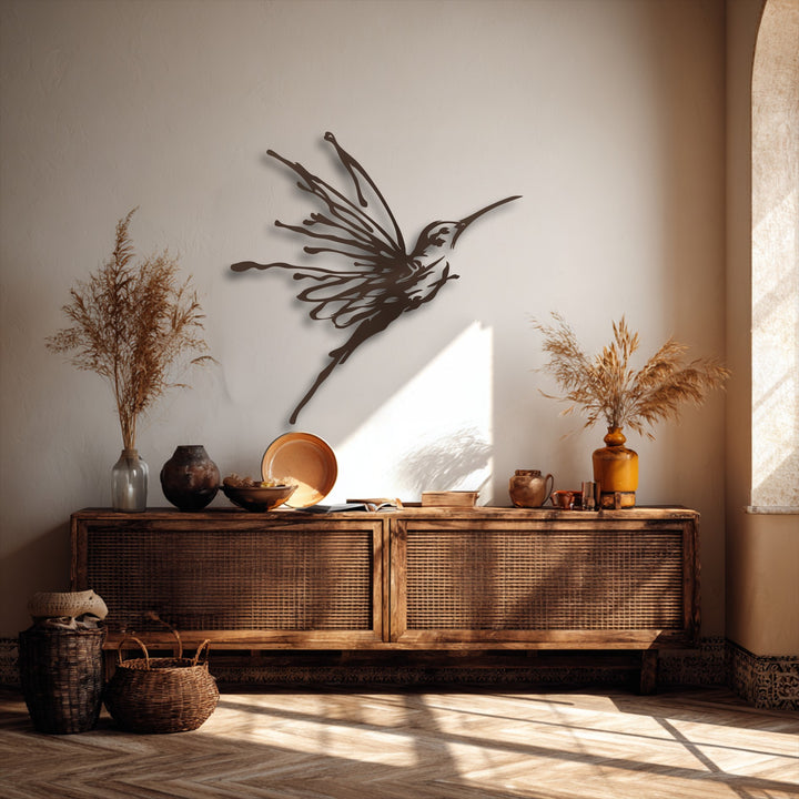 Sunlit herringbone wooden floor and rustic wicker baskets in the foreground, setting a warm scene for the elegant flying hummingbird decoration wall art.