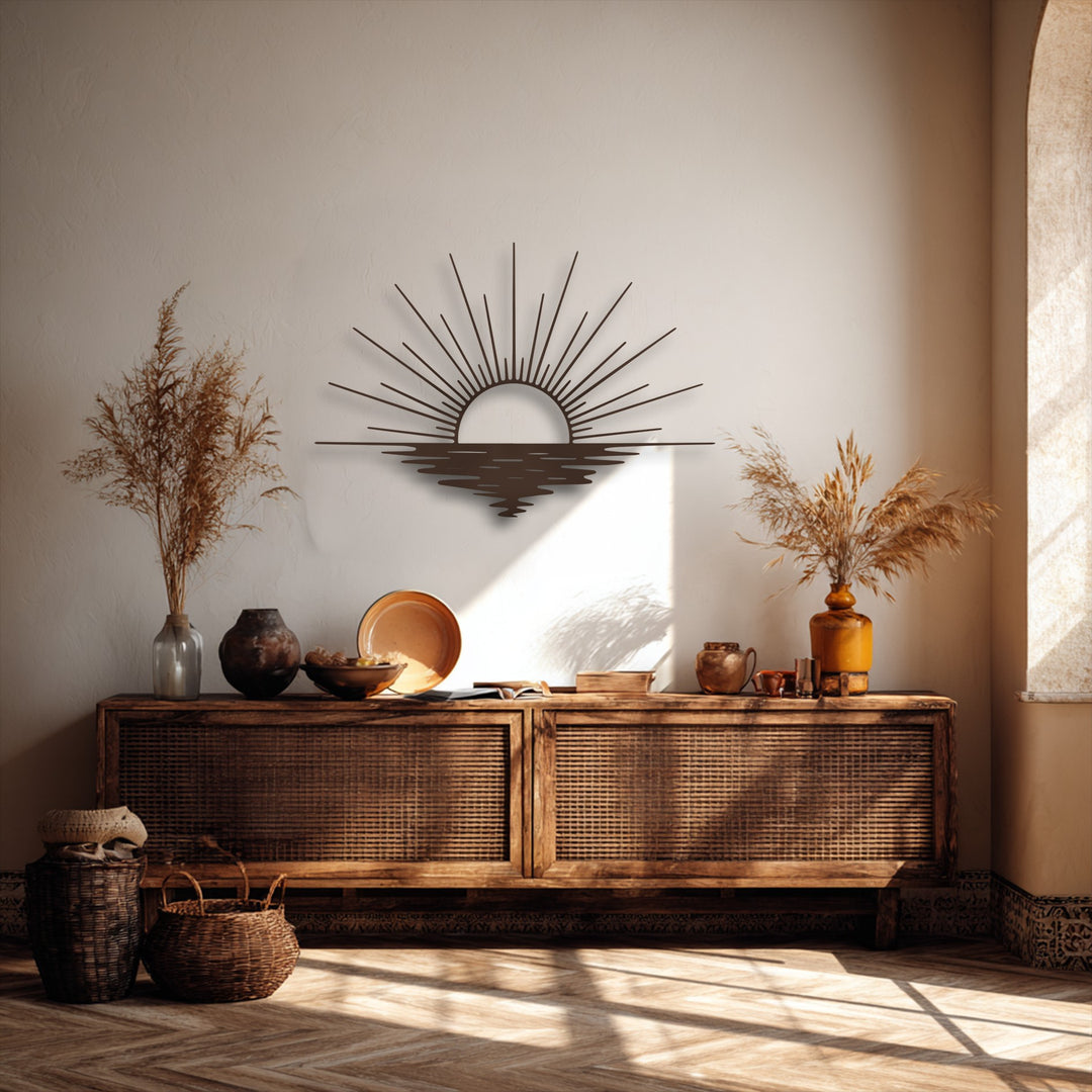 A stylish minimalist sun rays and ocean reflection metal art for wall serves as the central subject above a rustic wooden cabinet.