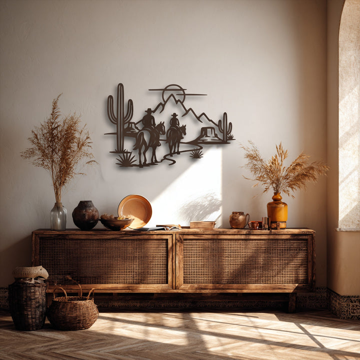 The focal point is a captivating metal wall decor depicting cowboy silhouettes on horses traversing a desert with saguaro cacti and mountains.