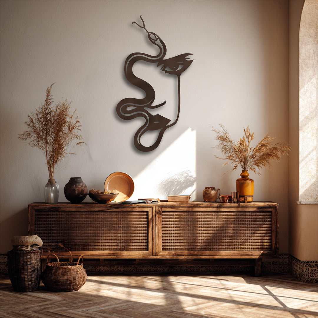 Low color saturation emphasizes the earthy tones of a brown abstract woman and serpent unique metal wall art above a rustic wooden console.