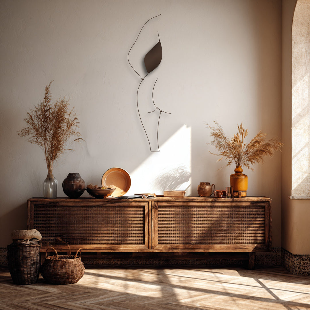 The high-quality, durable metal artwork beautifully renders a minimalist female silhouette line art with elegant precision.
