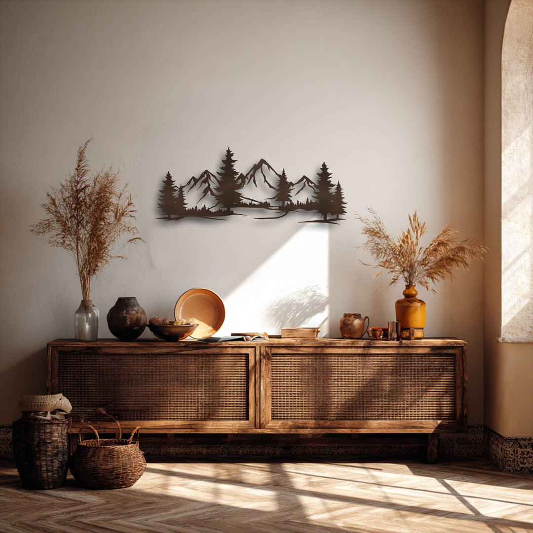 The muted color saturation highlights the earthy tones of the unique metal wall art featuring evergreen peaks and a mountain forest scene above a rustic cabinet.