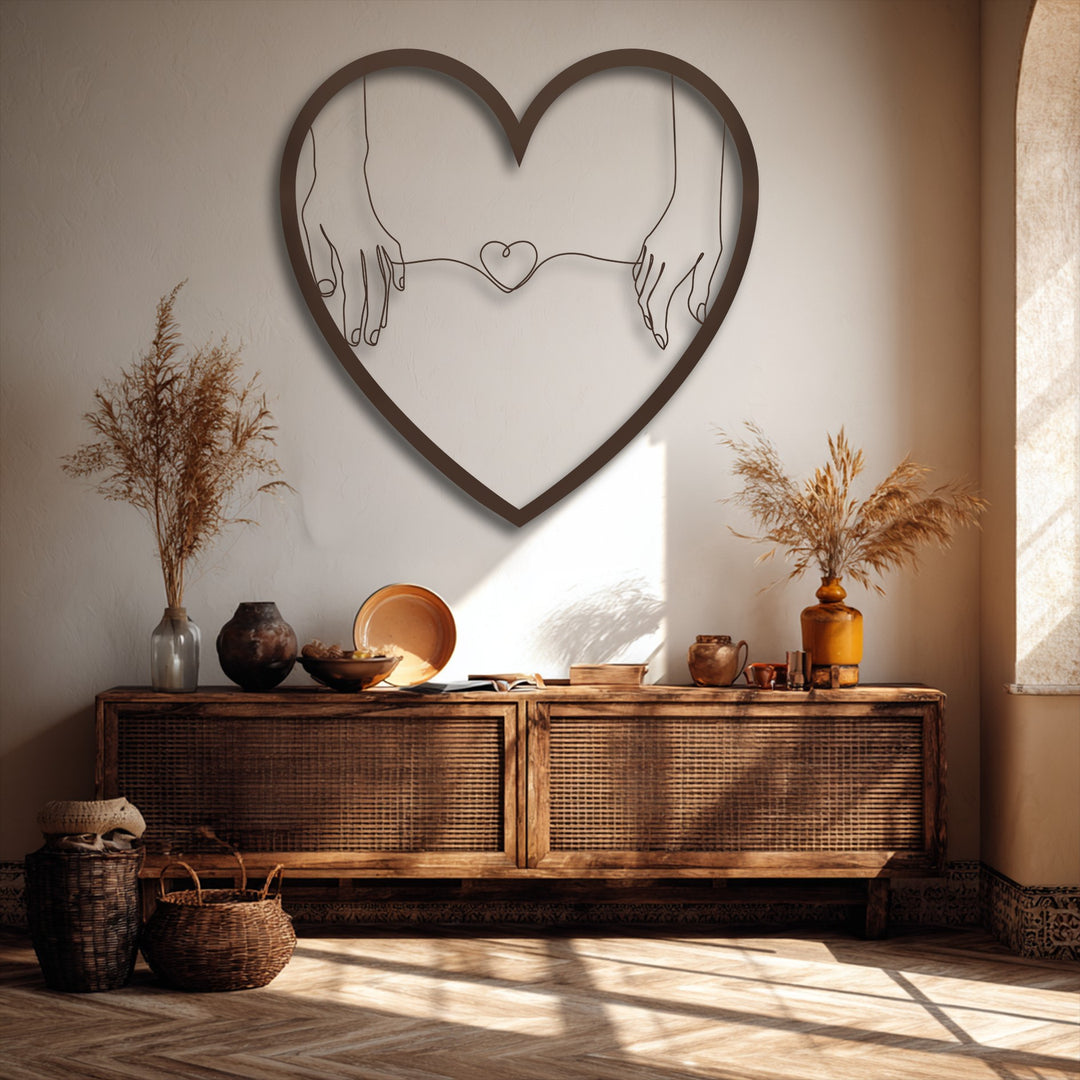 Elegant negative space within the Connected Hearts metal wall art outlines hands holding a small heart, creating stunning decoration wall art.