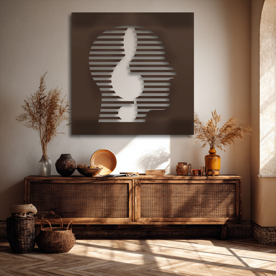 Dark brown decorative metal art depicting a modern abstract face with a minimal striped line portrait design.