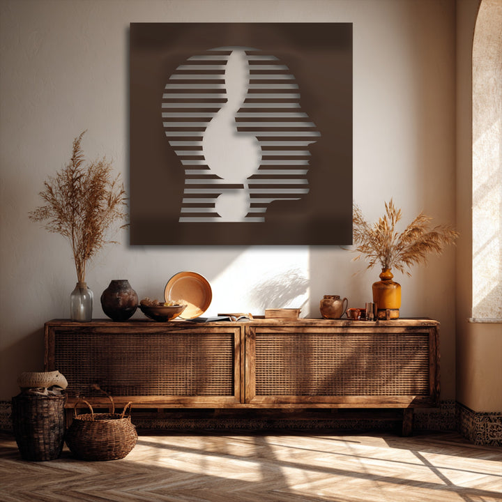Dark brown decorative metal art depicting a modern abstract face with a minimal striped line portrait design.