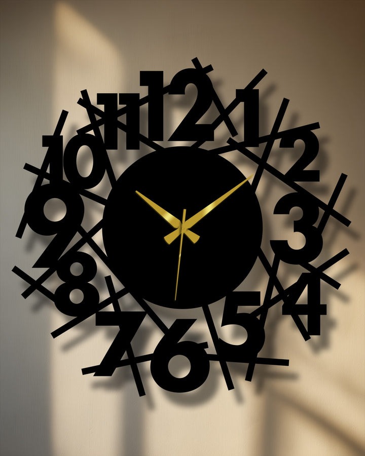Warm color temperature highlights the contemporary metal wall decor of this abstract number wall clock, with its chaotic yet stylish design and gold hands.