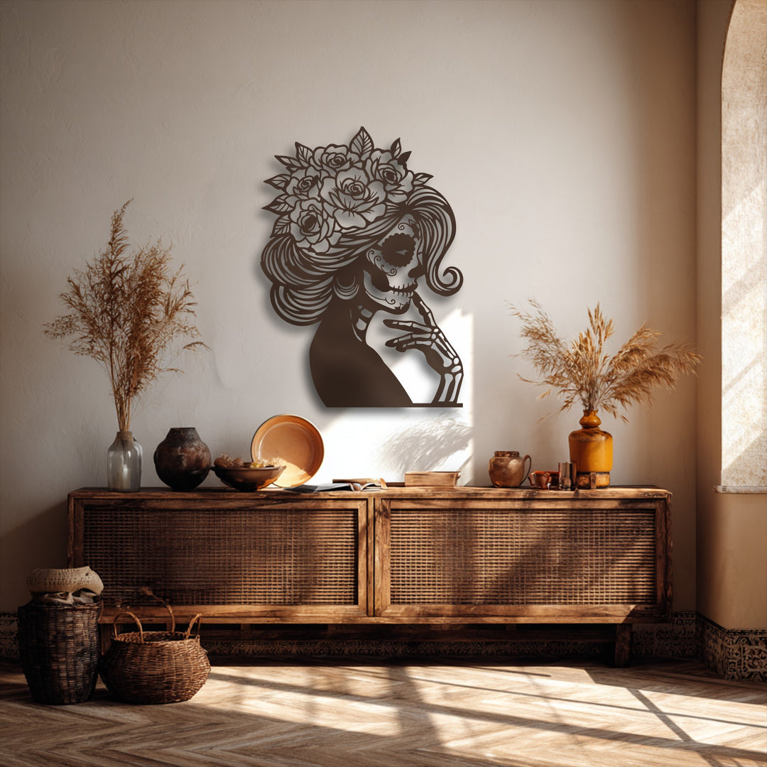 The focal point is an intricate dark brown metal artwork of a sugar skull lady wearing a floral crown, her hand to her chin.