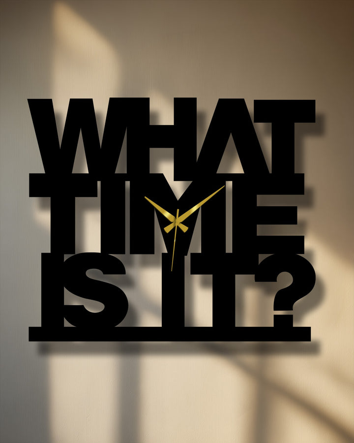 The darkest area of this decorative metal art clock features the bold text of 'What Time Is It' in a shadow-casting design.
