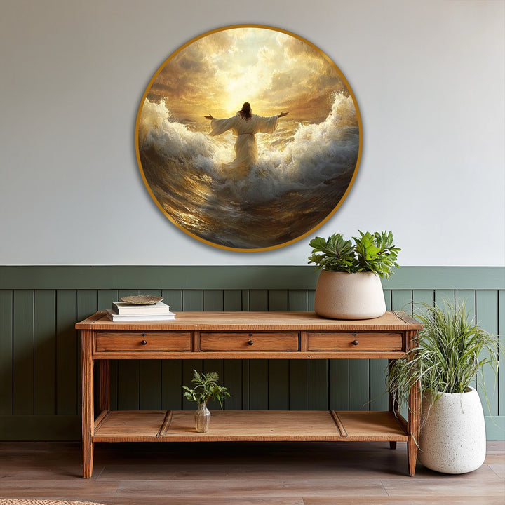 Wooden console table below a round, framed oil painting artwork featuring a figure amidst golden, stylized waves beneath a radiant, sunlit sky.