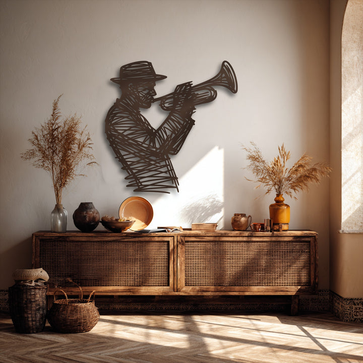 Dramatic light and shadow highlight the intricate Jazz Trumpet Player metal wall decor, casting defined forms on the textured wall and floor.