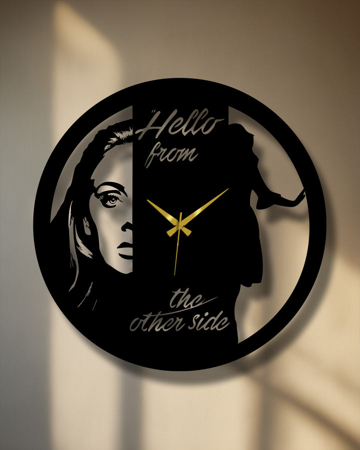 Negative space defines a striking artistic metal clock, with a dual face portrait design creating captivating wall prints within the circular silhouette.