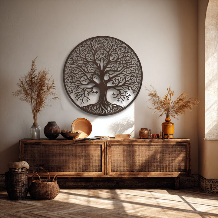 A textured beige wall serves as a serene backdrop for the detailed Tree of Life metal wall decor, illuminated by soft sunlight and distinct shadows.