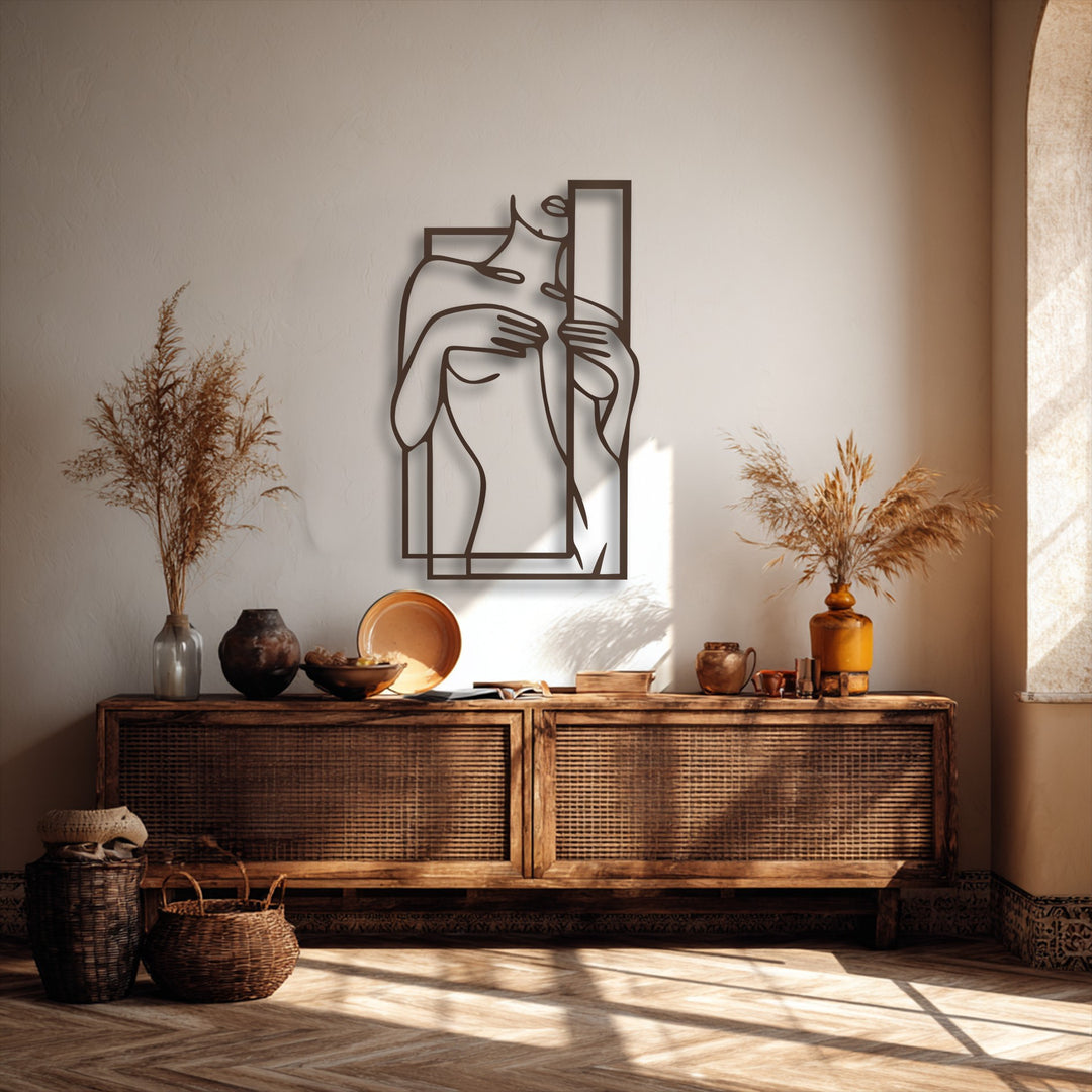 A striking minimalist female figure line art with a geometric frame stands out as elegant metal wall decor, perfectly styled.