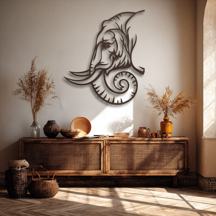 A majestic tribal-inspired elephant line art metal decoration wall art piece with intricate details and a distinctive swirling trunk.