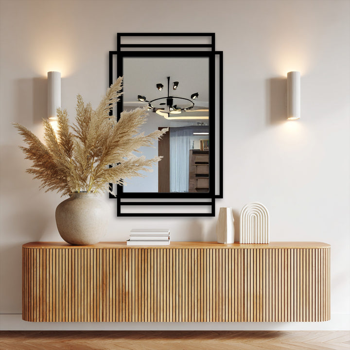 Play of light and shadow defines the geometric layered frame of this rectangular mirror for wall decor, highlighting its minimal black lines.