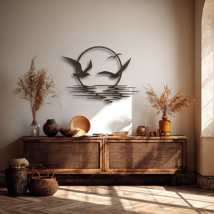 The matte, rustic bronze finish of the soaring seagulls sunset metal art for wall adds depth, enhancing its intricate coastal ocean decor.