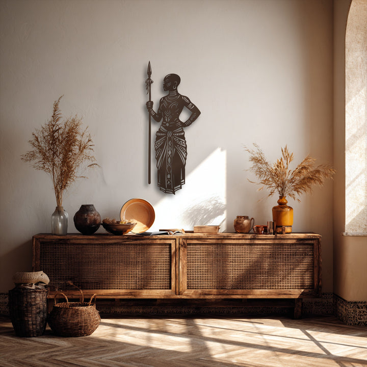 Visual rhythm is evident in the tribal African warrior metal wall decor holding a spear, balanced by warm tones and organic textures.