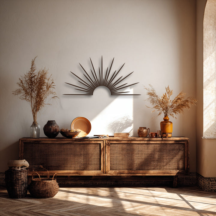 Two handcrafted woven baskets rest on the sunlit herringbone floor, complementing the modern radiant sunburst metal artwork above.